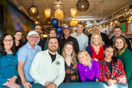 Blue Pebble team members at company holiday celebration